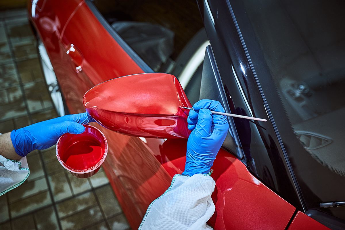 Image of painting a side mirror of a car, Auto Aid Collision, Auto Paint Shop