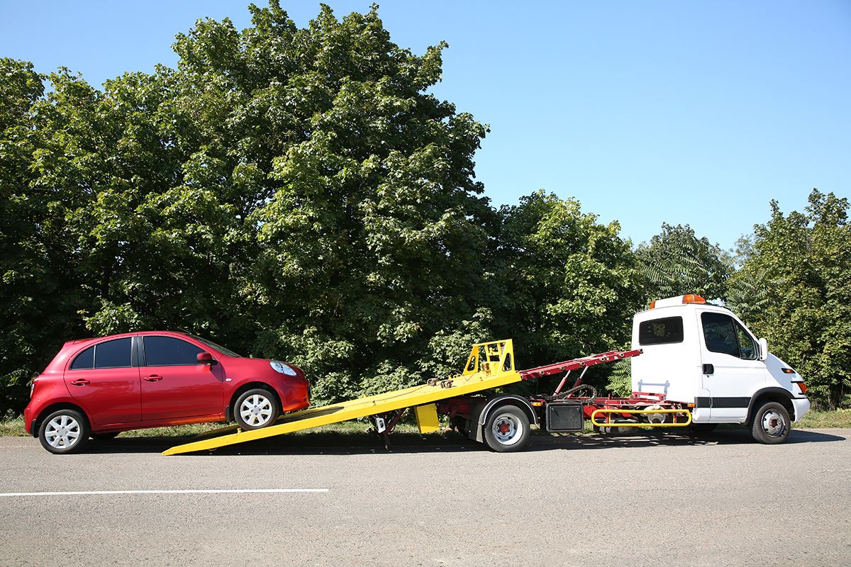 Image of twoing the cars, Auto Aid Collision, Towing Service For Repairs