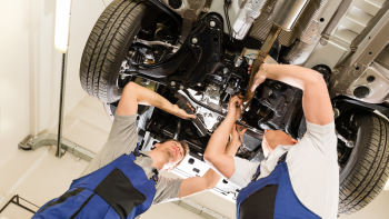 Two Mechanics under car Repairing,Auto Aid Collision